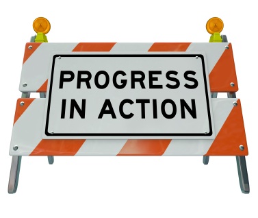 Picture of road sign showing progress in action